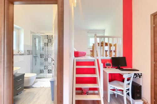 a bedroom with a bunk bed and a desk with a computer at Villa Lasa in Pazin