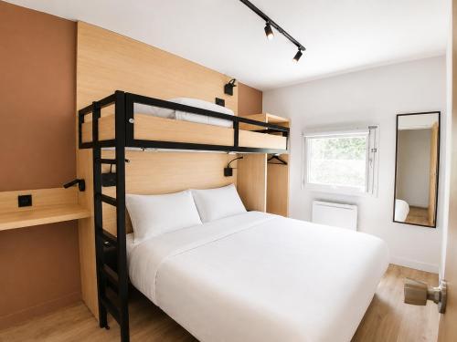 a bedroom with a bunk bed with a white bed at Kyriad ECO - Tours Nord in Tours