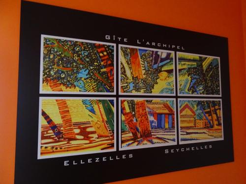 a framed picture of buildings on a wall at Archipel Holiday Cottage in Ellezelles