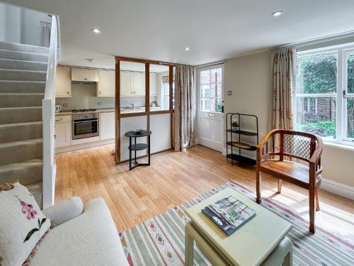 a living room with a couch and a table at Militia Cottage in Marlborough