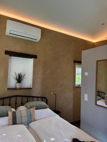 a bedroom with two beds and a air conditioner at Alte Schmiede in Sundern
