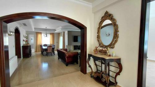 a living room with a large mirror on the wall at Villa Tiara by HolidayKeys in Kyrenia