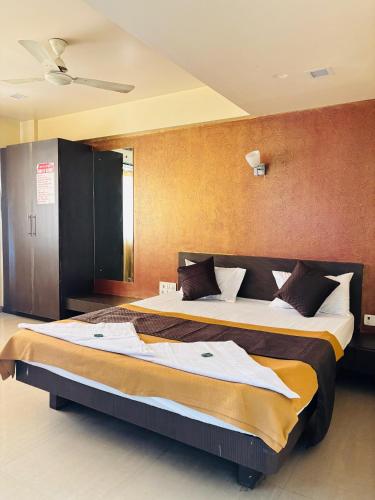 a bedroom with two beds in a room at Sun N Shine in Pune
