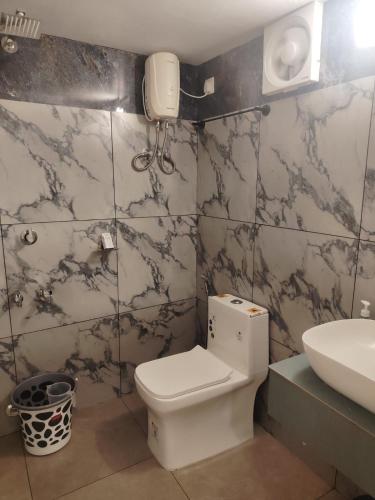 a bathroom with a toilet and a sink at The Beach House Marari in Mararikulam