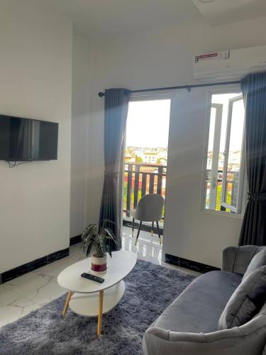a living room with a couch and a table at Bristol Court in Kathmandu