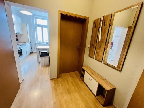 a room with a door and a television on a wall at Haus Juliane, Neptun in Warnemünde
