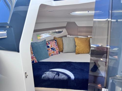 a bed in the back of a boat at Siesta Luxury Love Boat - NOCLEG NA ŁODZI W MARINIE SOLNEJ in Kołobrzeg