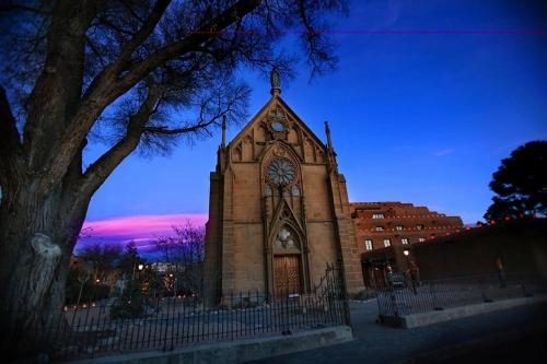 a church with a clock on the front of it at Inn & Spa at Loretto in Santa Fe