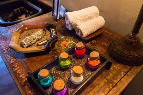 a table with a tray of food and bottles on it at Inn & Spa at Loretto in Santa Fe