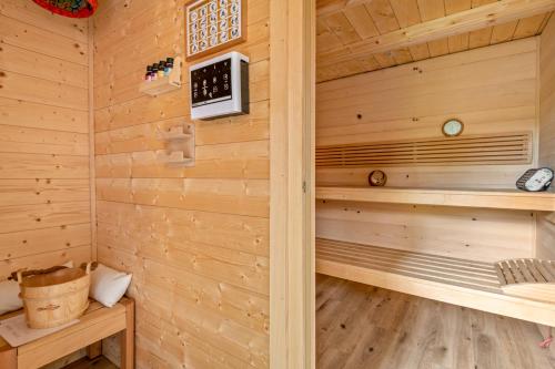 a sauna in a wooden cabin with wooden floors at Ferienhütte 15 in Sankt Englmar