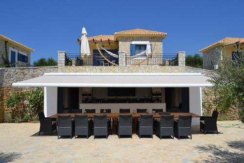 a group of chairs sitting in front of a stage at Fairway Villas, A Terra Lusso Property in Gialova
