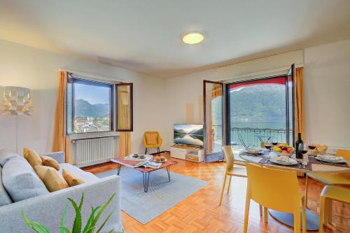 a living room with a couch and a table at 76 The Lake House - Lugano in Melide