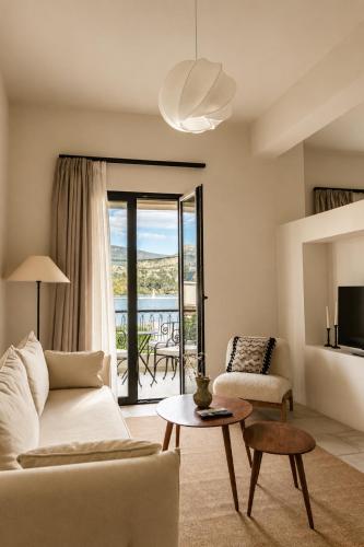 a living room with a couch and a table at Lanu Apartments in Argostoli
