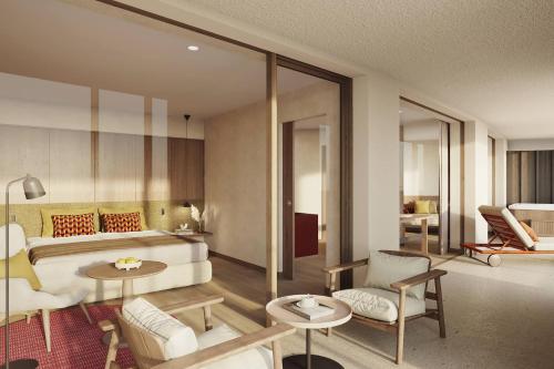 a bedroom with a bed and a living room at Ganis Resort in Nova Ponente
