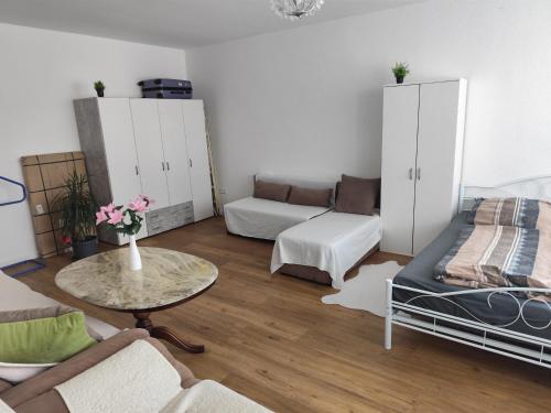 a living room with a couch and a table at Appartement in Hannover