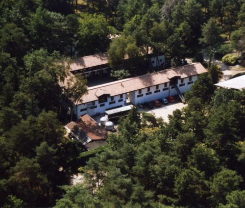 an aerial view of a building in the middle of a forest at Agriturismo La Garzonera in Vergiate