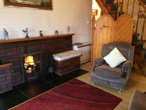 Un lugar para sentarse en Hillcrest Holiday Home