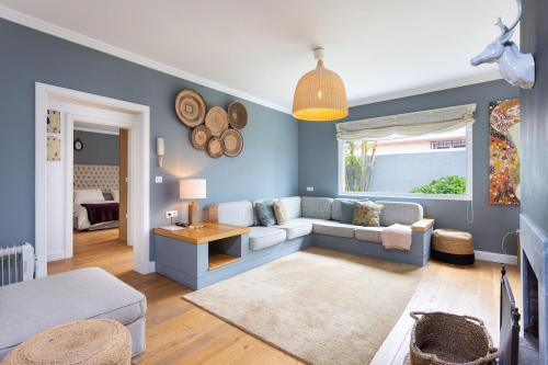 a living room with a couch and a table at Views Spacious Villa in El Rincón