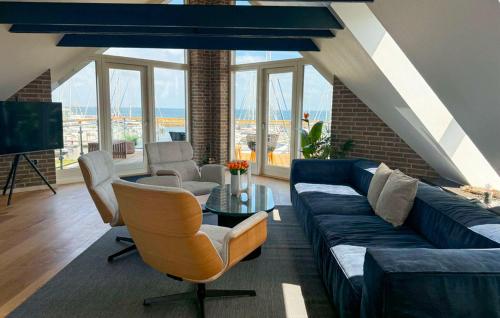 a living room with a couch and a table at Awesome Home In Haderslev With Sauna in Haderslev