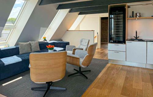 a living room with a couch and a table at Awesome Home In Haderslev With Sauna in Haderslev