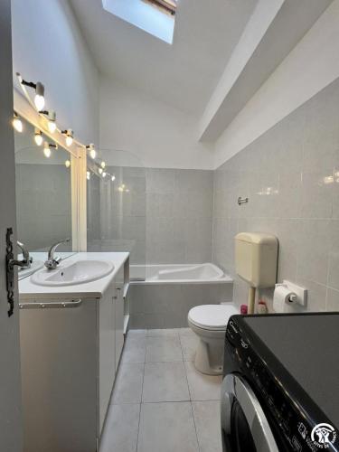 a bathroom with a sink and a toilet and a tub at Rafael in Quintillan