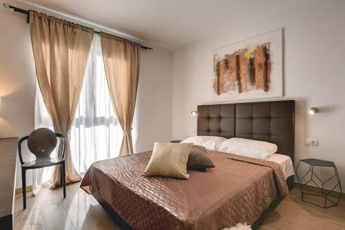 a bedroom with a large bed and a window at Villa Orion - Private Heated Pool, Sauna & Jacuzzi in Rovinj
