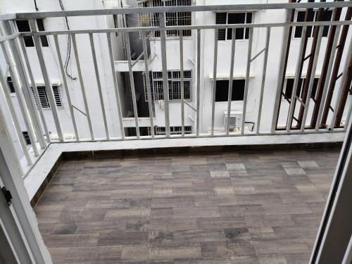 a balcony with a view of a building at Green fields in Vijayawāda