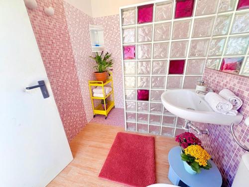 a small bathroom with a sink and a toilet at Villa Mansa in Pechina