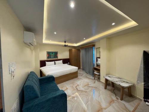 a hotel room with a bed and a couch at Hotel Skyline in Janakpur