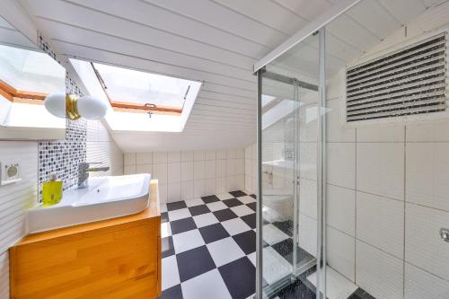a bathroom with a sink and a shower at The Townhouse Apartment in Kaş