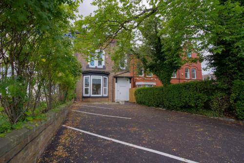 an empty parking lot in front of a house at Stockton Suites in Stockton-on-Tees
