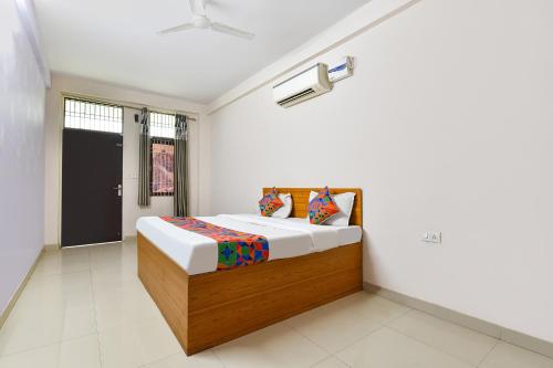 a bedroom with a bed in a room at FabHotel Palak Palace in Jaipur