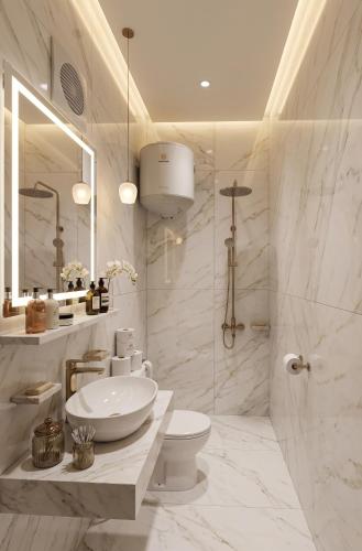 a bathroom with a sink and a toilet and a mirror at Parque Praca hotel in Cairo