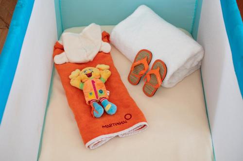 a birthday cake with a teddy bear on a towel at Martinhal Lisbon Chiado in Lisbon
