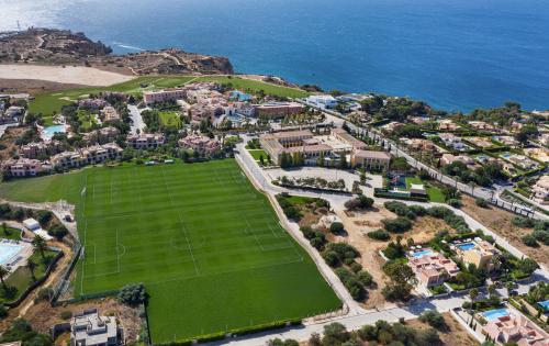 an aerial view of a soccer field next to the ocean at Cascade Wellness Resort Lagos Algarve by Domes in Lagos