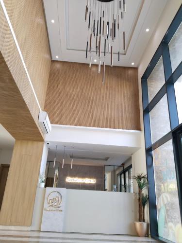 a chandelier hangs from the ceiling in a lobby at Résidence Costa in Sousse