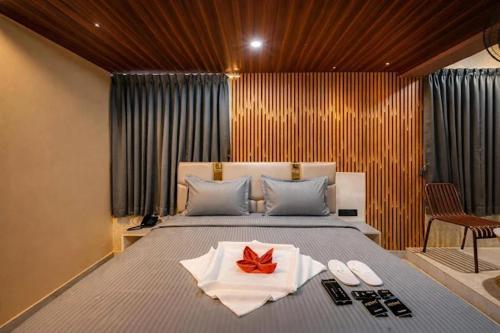 a bedroom with a bed with a red bow on it at Hotel Rism Suites Koramangala in Bangalore