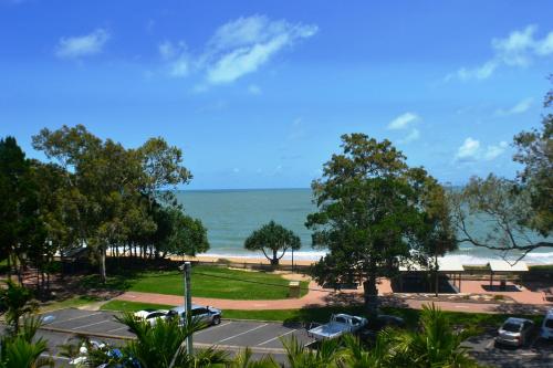 a view of the beach from a parking lot at Charlton on The Esplanade in Hervey Bay