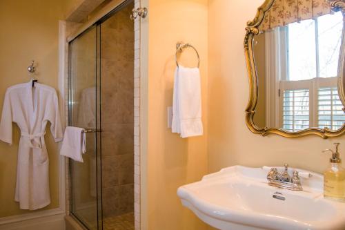 a bathroom with a sink and a shower at Oak Hill On Love Lane Bed and Breakfast Inn in Waynesville