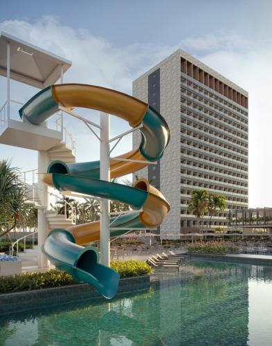 a slide in front of a swimming pool at Beach GAV Resorts in Salinópolis