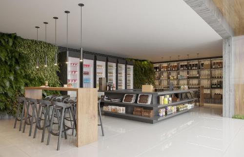 a wine store with a bar and stools at Beach GAV Resorts in Salinópolis