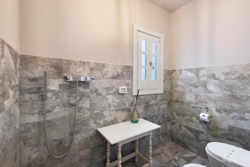 a bathroom with a shower and a sink and a toilet at Villa La Cucchiara in Santa Caterina di Nardò