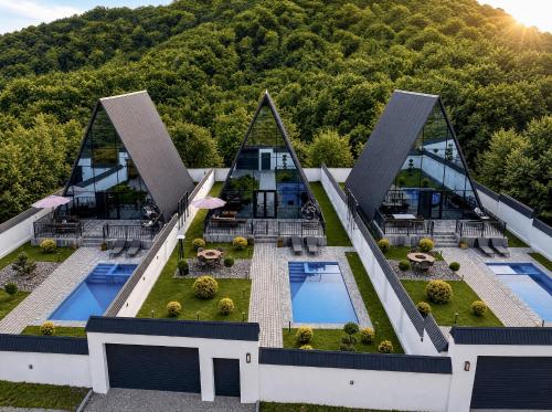 an aerial view of a building with two swimming pools at Qafqaz Falcon Chalet in Gabala
