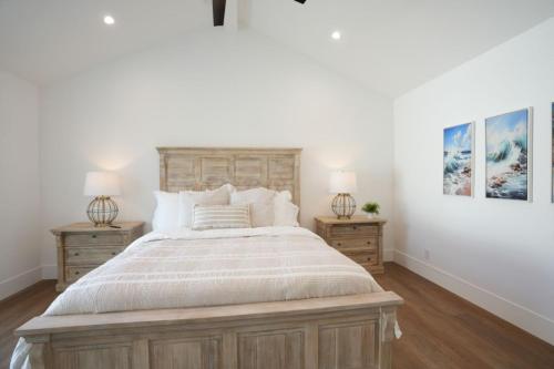 a bedroom with a large bed with two night stands at Beautiful Home with 4 bedroom, 2 bathrooms-full amenities in Orange
