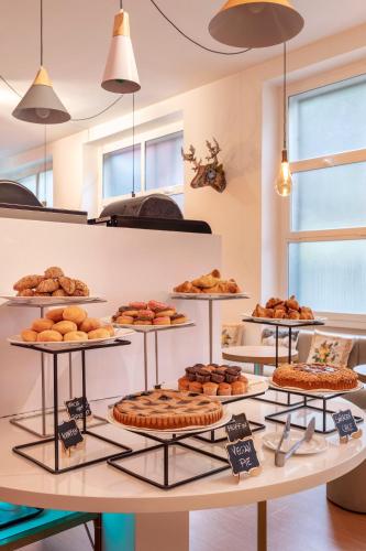 a bakery with a variety of pastries and pies at B&B HOTEL Catania Bellini in Catania