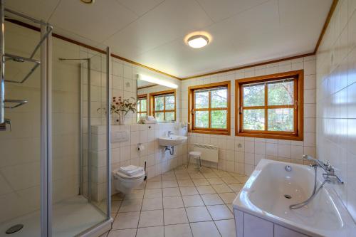a bathroom with a toilet and a sink and a shower at Heideröschen Park Heideröschen 7 in Zingst