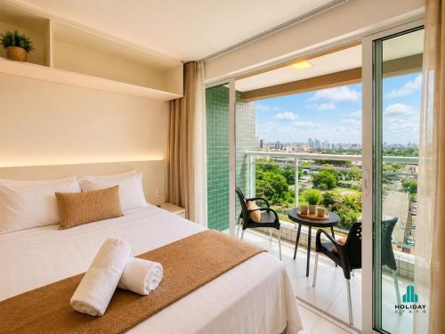 a bedroom with a bed and a large window at Fortaleza Sul by Holiday Stays in Fortaleza