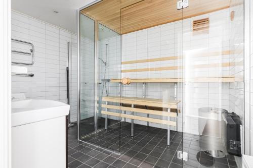 a bathroom with a glass shower and a sink at Funäs Ski Lodge in Funäsdalen