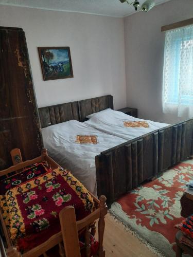 a bedroom with a bed with a blanket on it at Do Vuceljica in Andrijevica