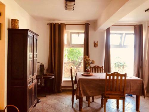 a dining room with a table and a window at A house with the view in Bar